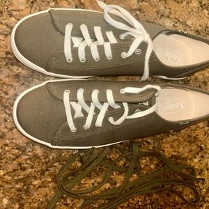 Keds Khaki Canvas Sneakers with White Accents, matching shoe strings included.